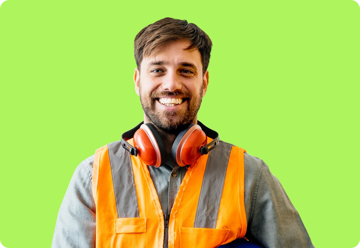 Manufacturing worker with safety headphones